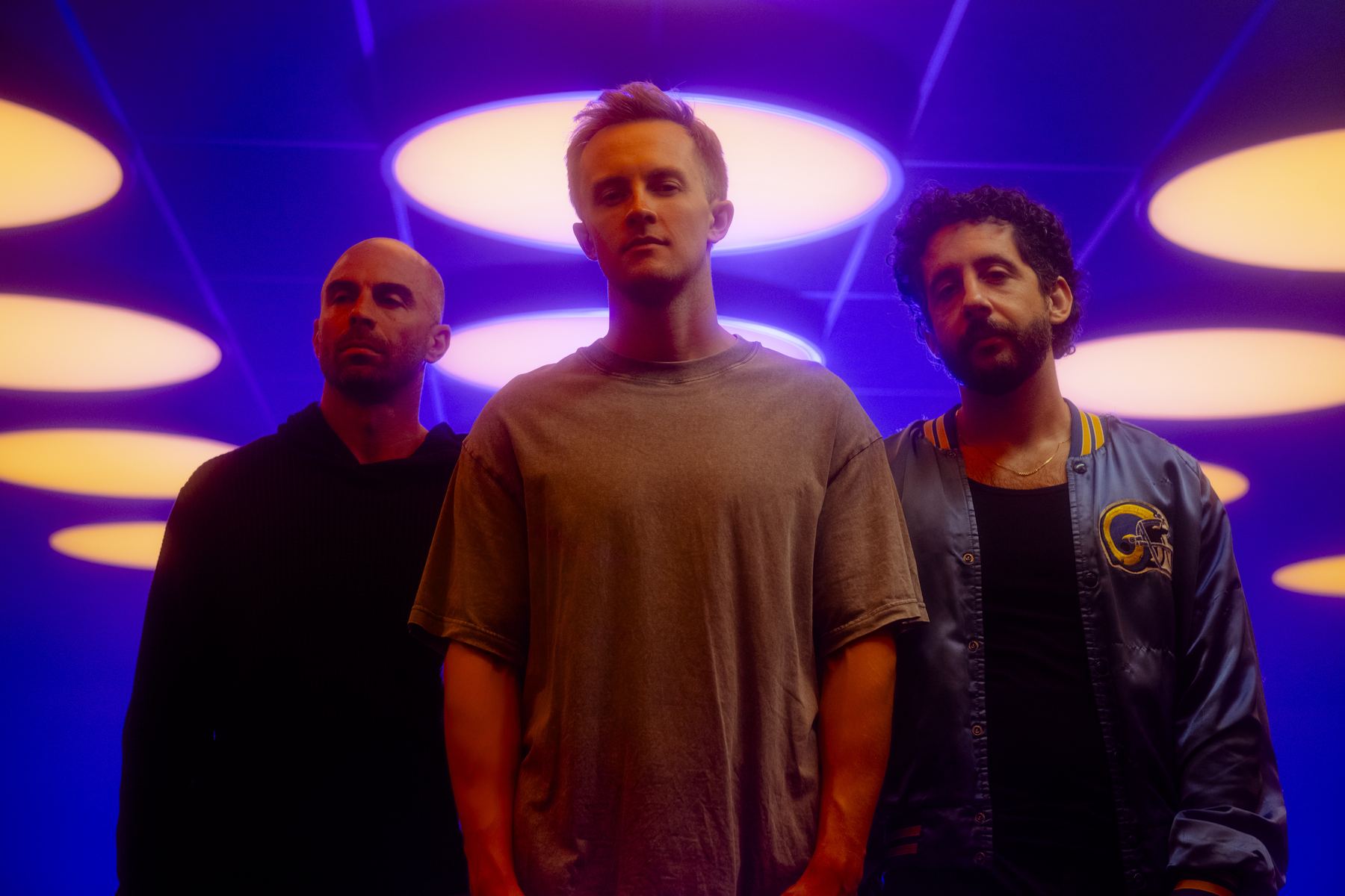 Peter, Alex and Mickey under purple ceiling lights